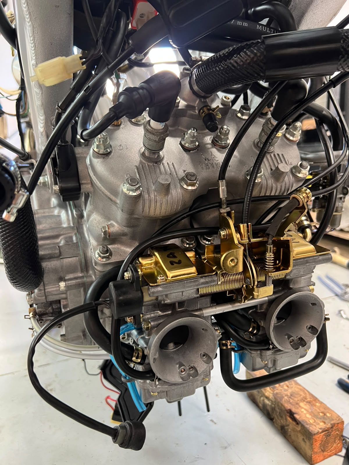 Two-stroke engine with carburettors during rebuild